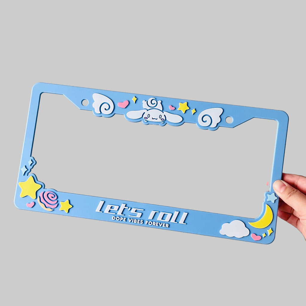Blue license plate frame with Cinnamoroll design with white text "Let's roll"