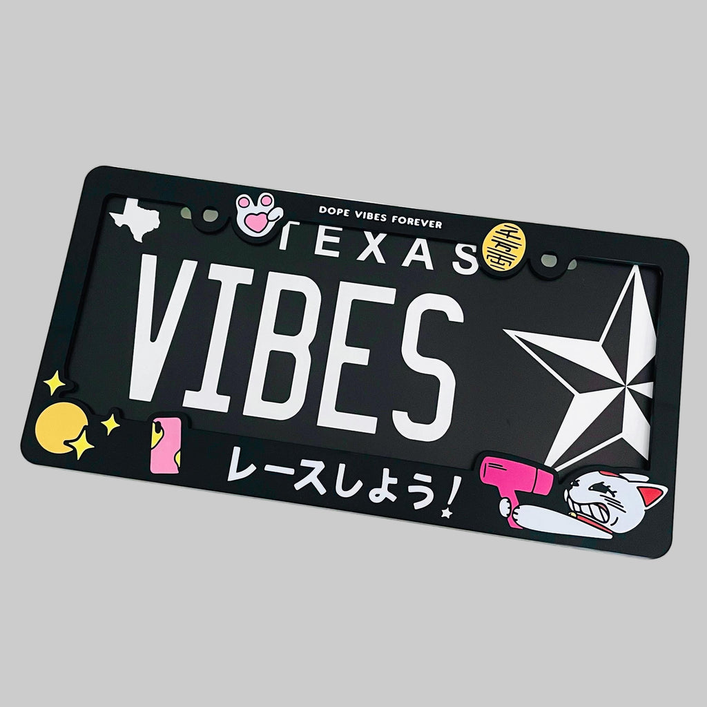 Black license plate with 'VIBES' text and graphics on a white background