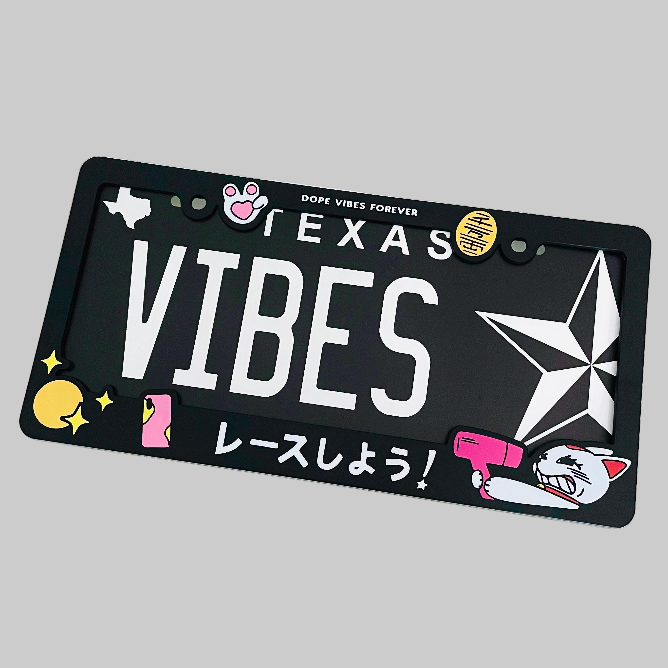 Black license plate with 'VIBES' text and graphics on a white background