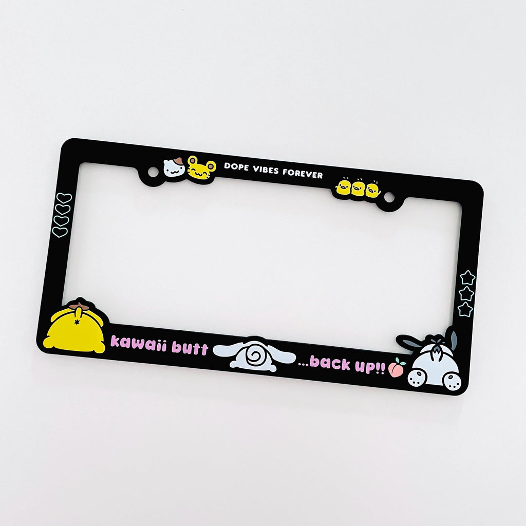 Black license plate frame with Cinnamoroll, PomPomPurin, and Pochacco designs. Text reads "Kawaii butt, back up!!"